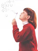 Child blowing bubbles